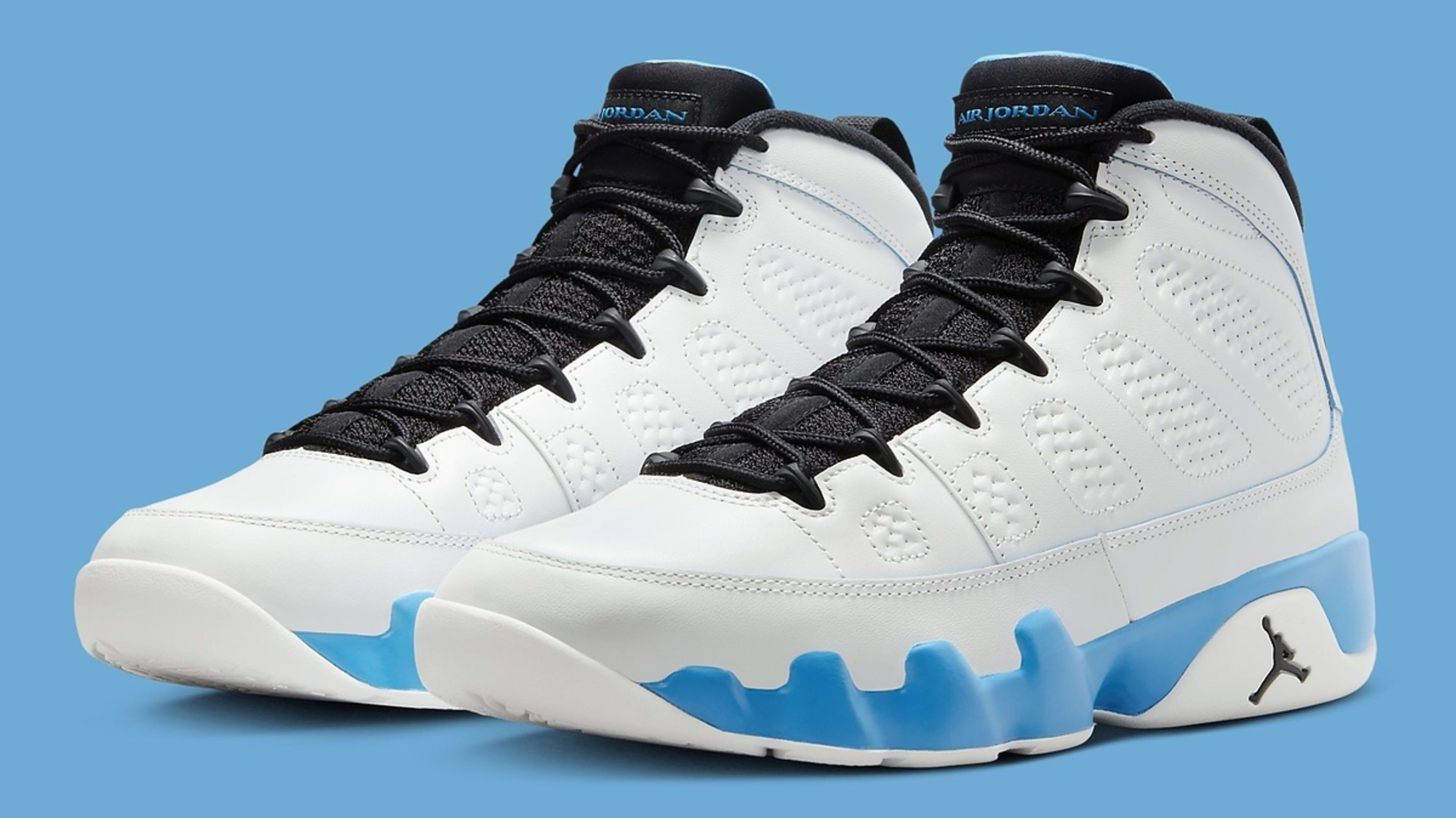 A pair of white and blue Air Jordan sneakers against a blue background