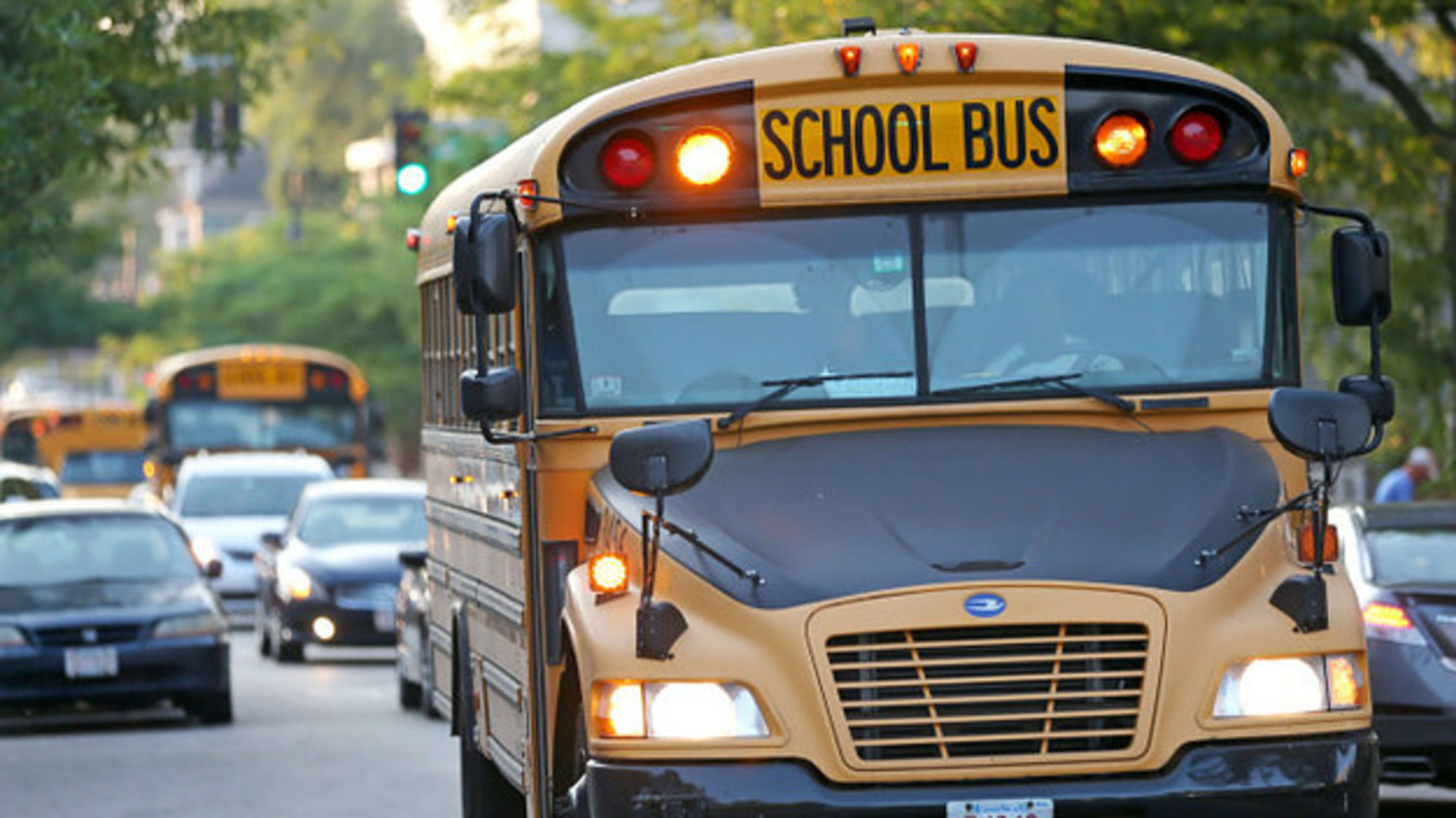 A school bus drives on Geneva Avenue