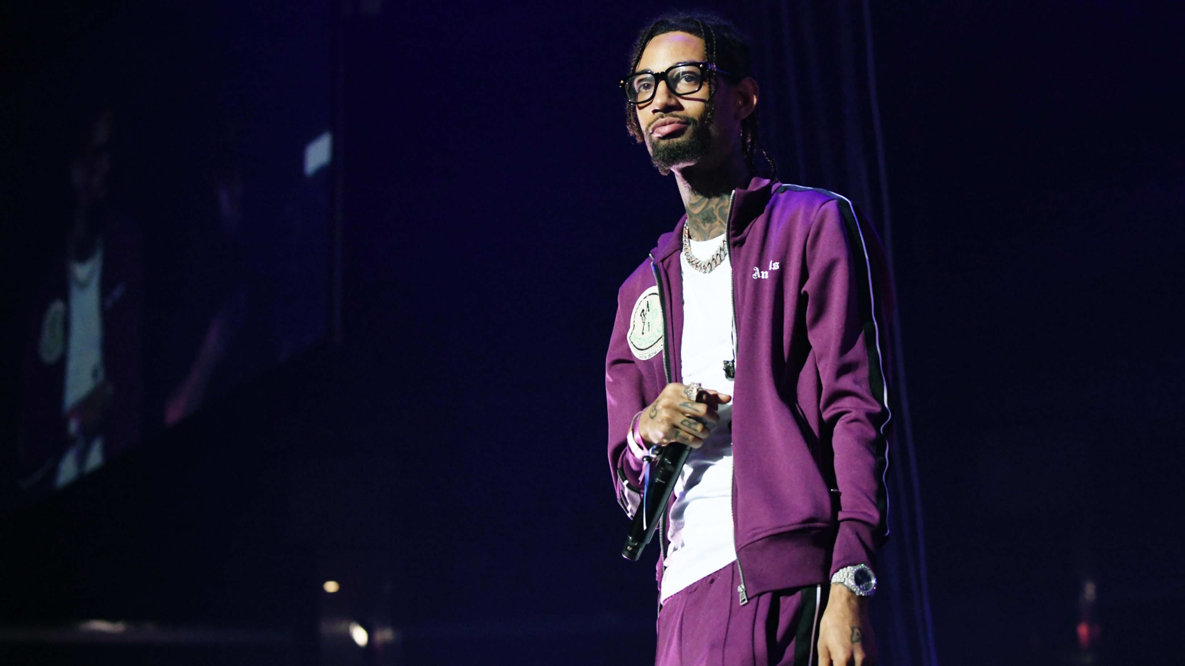 PnB Rock is seen performing live.