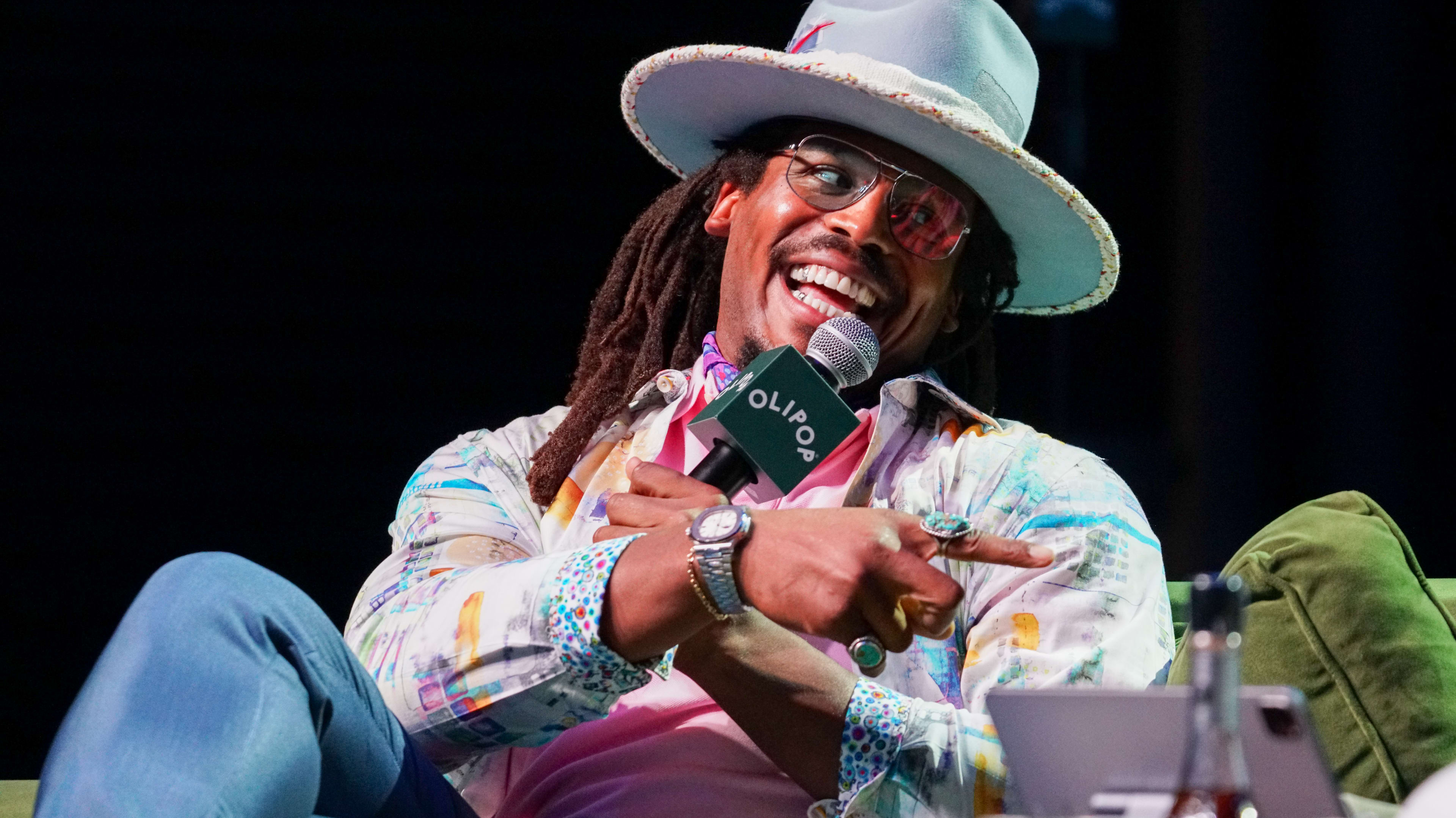 ATLANTA, GEORGIA - AUGUST 22: Cam Newton speaks onstage during the Nightcap Summer Sessions at Buckhead Theatre on August 22, 2024 in Atlanta, Georgia.