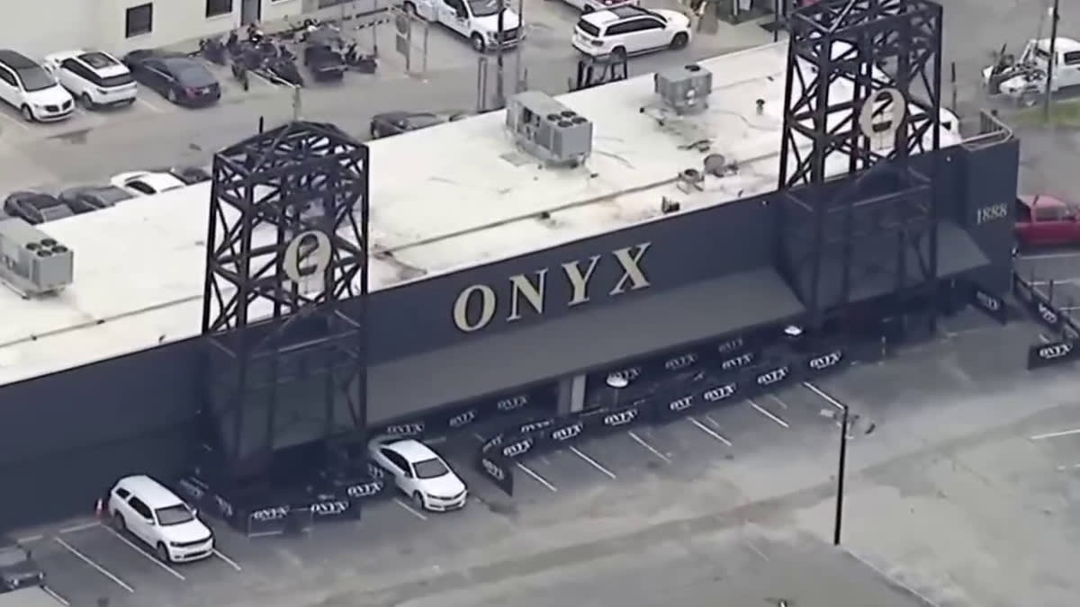 Aerial view of ONYX building with a parking lot