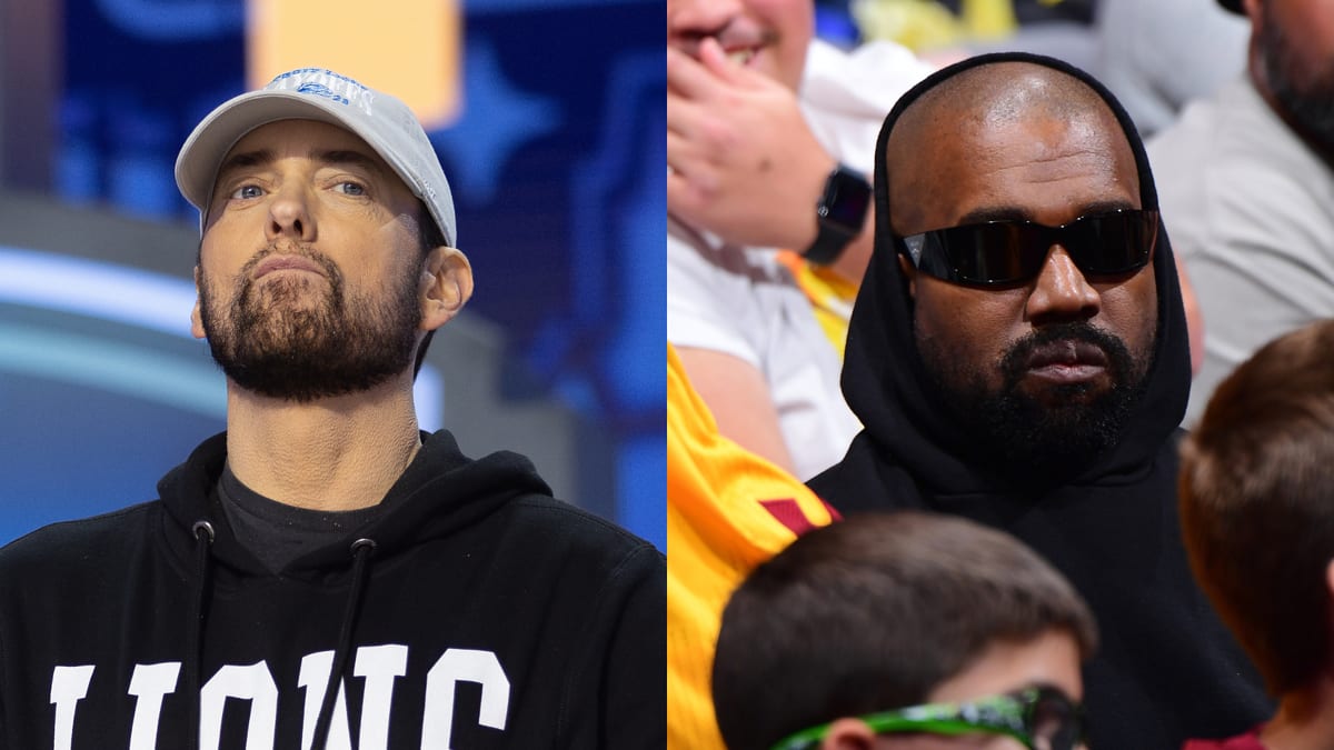 Eminem in a casual hoodie and cap, and Kanye West in a hooded sweatshirt and sunglasses at a music event