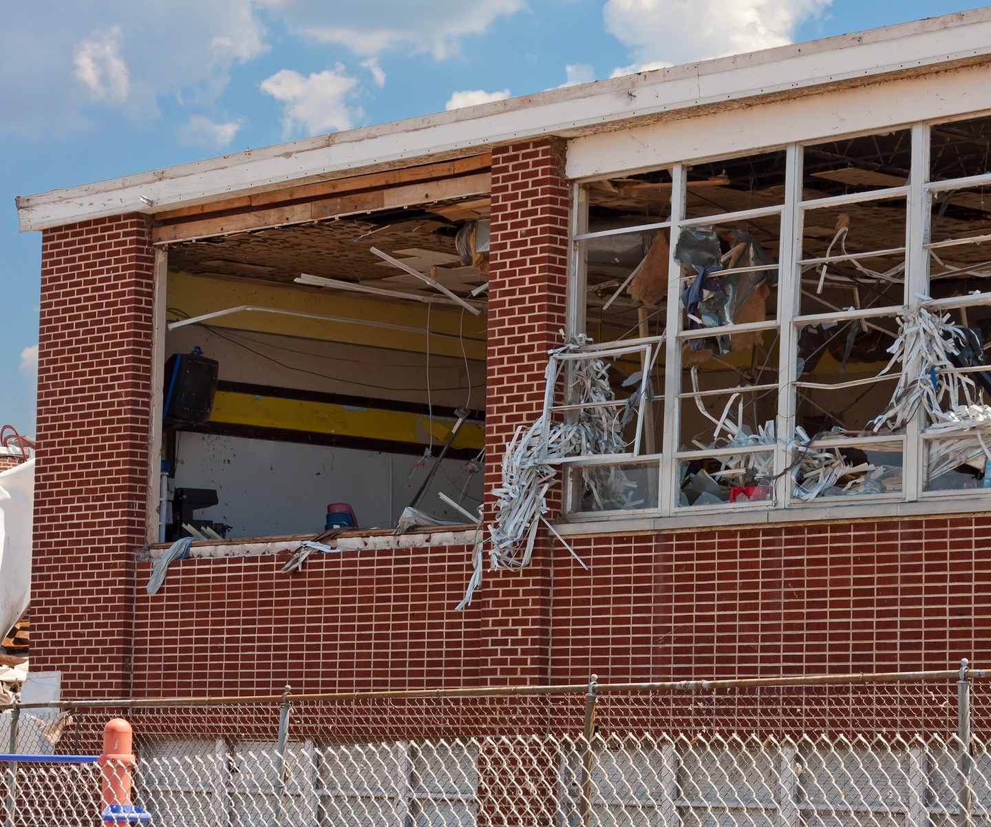 Exterior view of commercial building with storm damage