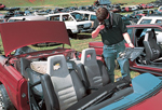 Employee researching cars at a junkyard