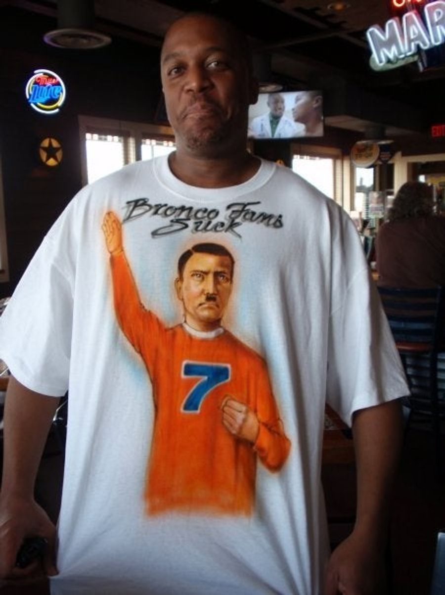 For Your Consideration: A Man Wearing An Airbrushed T-Shirt With John Elway As Adolf Hitler