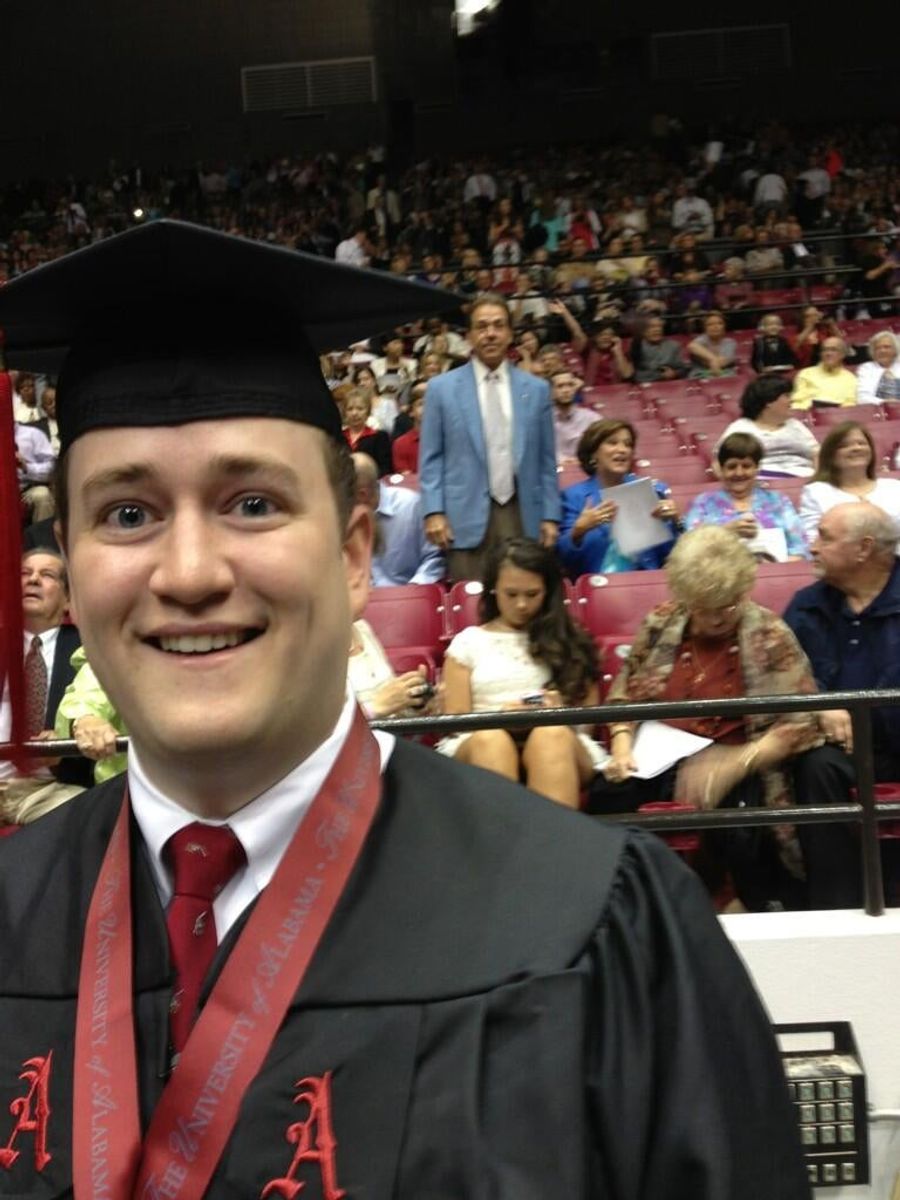 Here&#39;s Nick Saban In The Background Of Some Kid&#39;s Graduation Photo