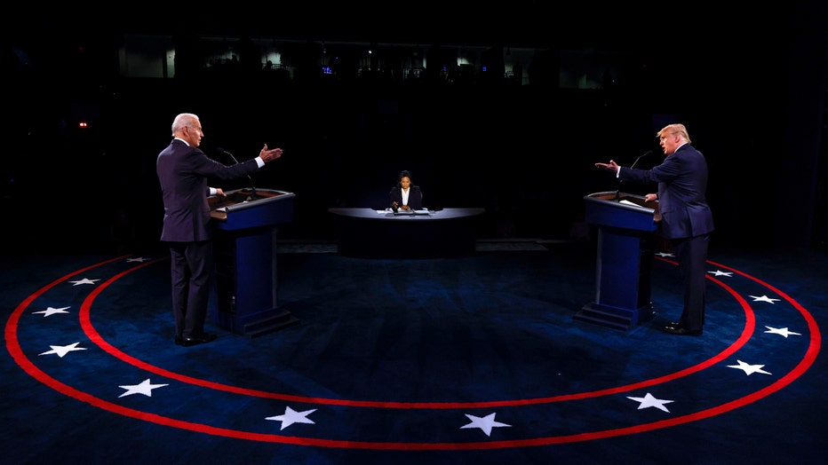 Then-President Donald Trump and former US Vice President Joe Biden participate in the final presidential debate at Belmont University in Nashville, Tennessee, on October 22, 2020. (Photo by JIM BOURG/POOL/AFP via Getty Images)