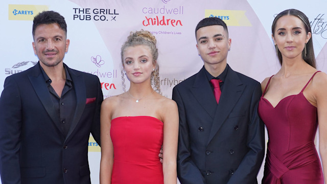 Junior on red carpet with his dad, stepmum, and sister Princess