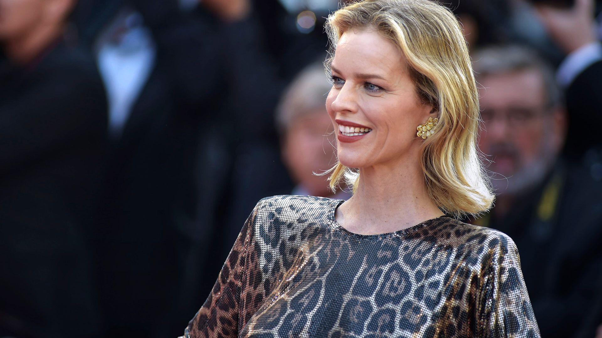 Eva Herzigova smiling on the red carpet