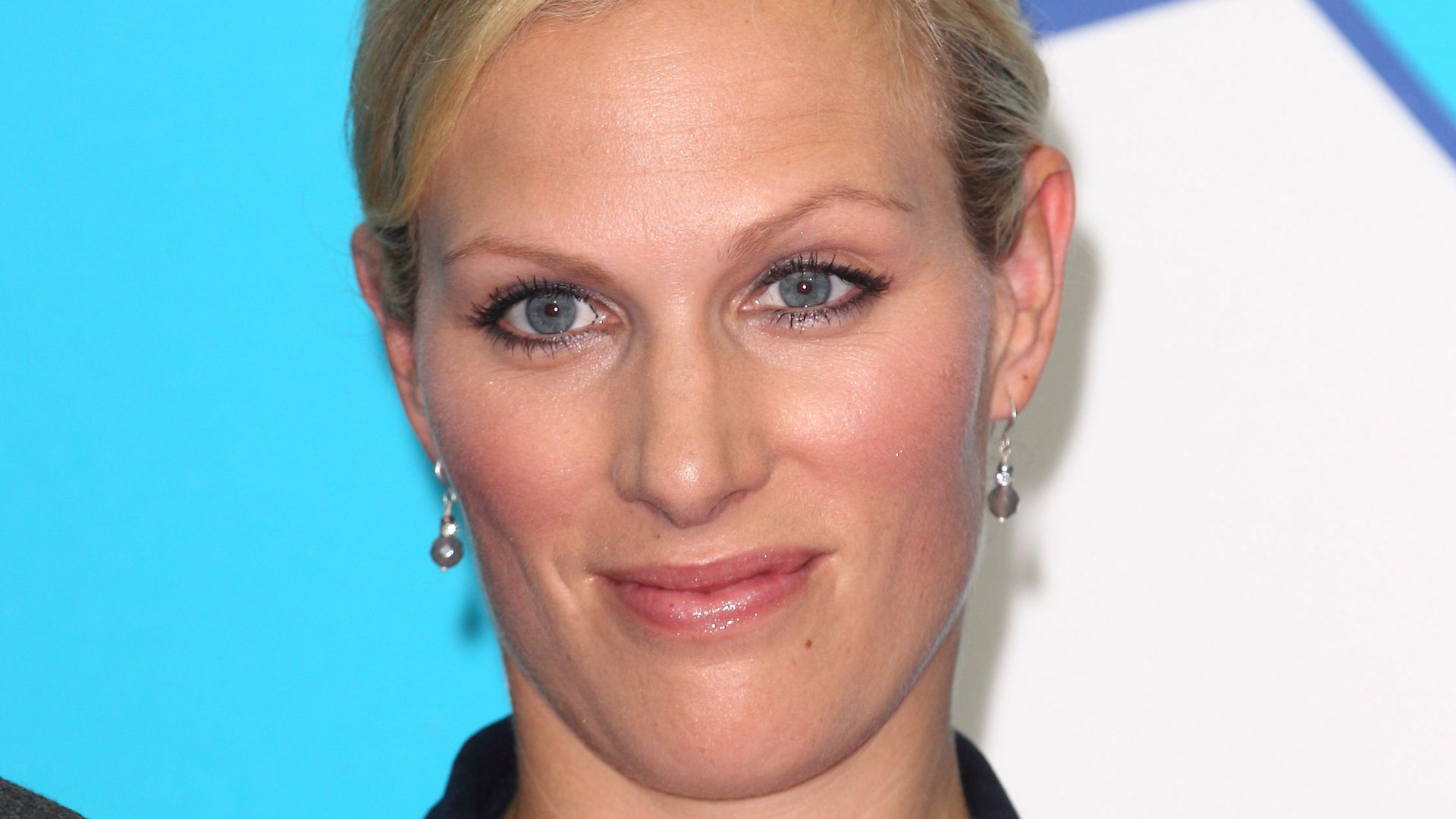 Zara Tindall in a black blazer with her hair up