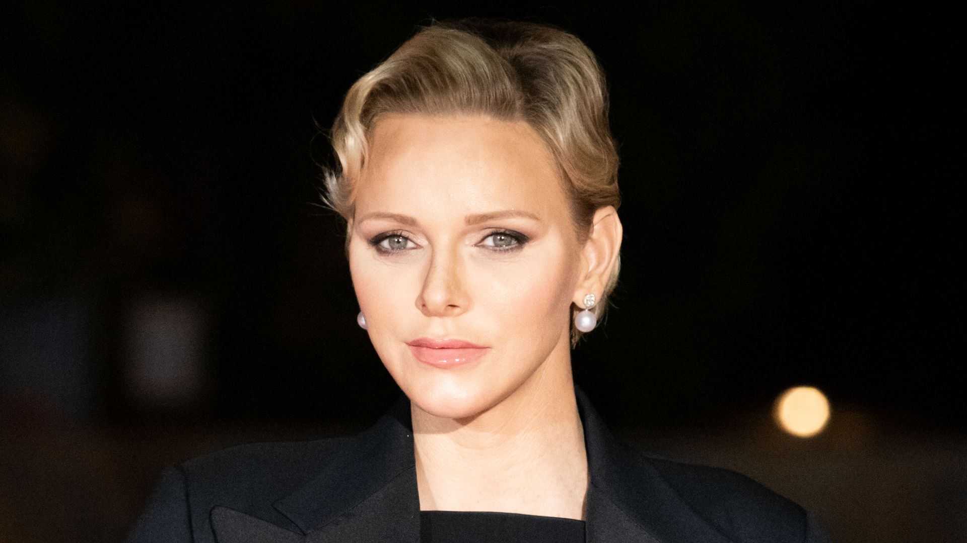 Princess Charlene of Monaco wears a black suit