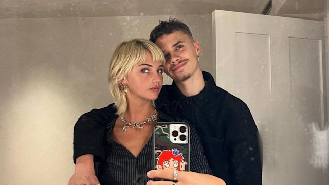 Mia Regan posing in the mirror with Romeo Beckham