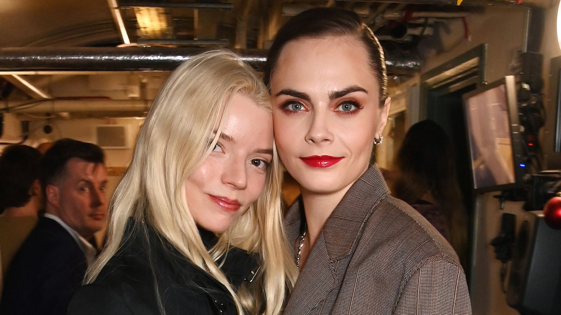 Anya Taylor-Joy and Cara Delevingne posing together 