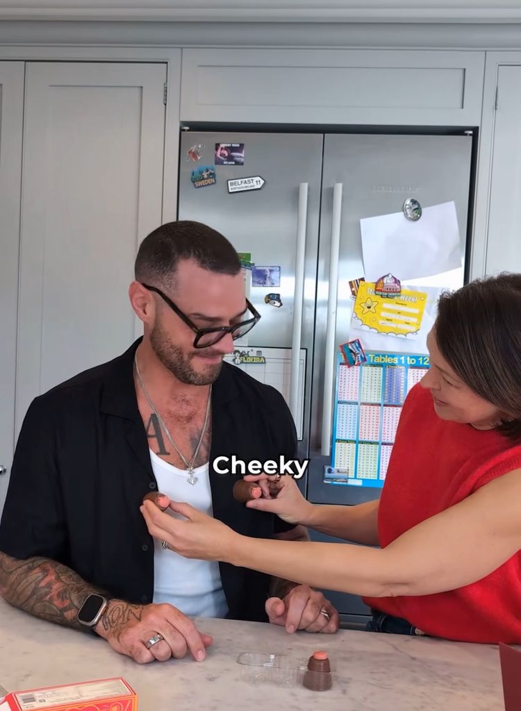 A photo of Emma Willis holding walnut whips on Matt Willis