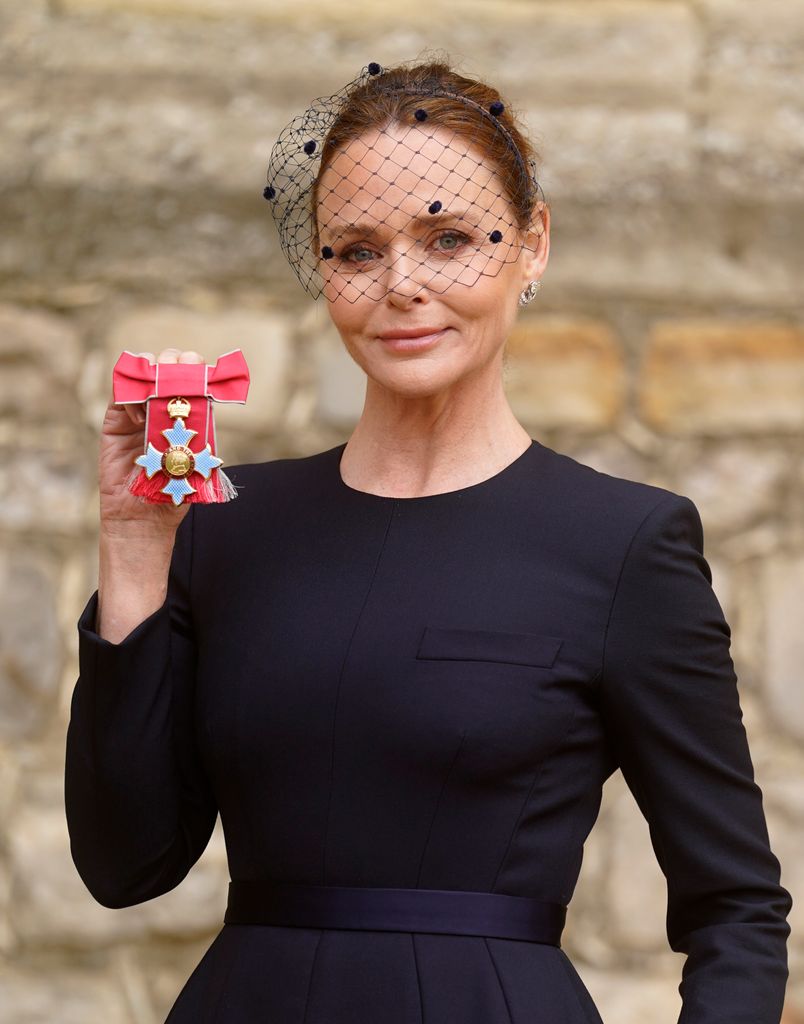 Stella McCartney wearing an Emily-London headpiece to receive her OBE in 2023