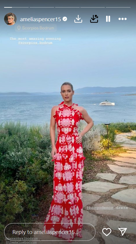 Amelia Spencer in red dress at sunset