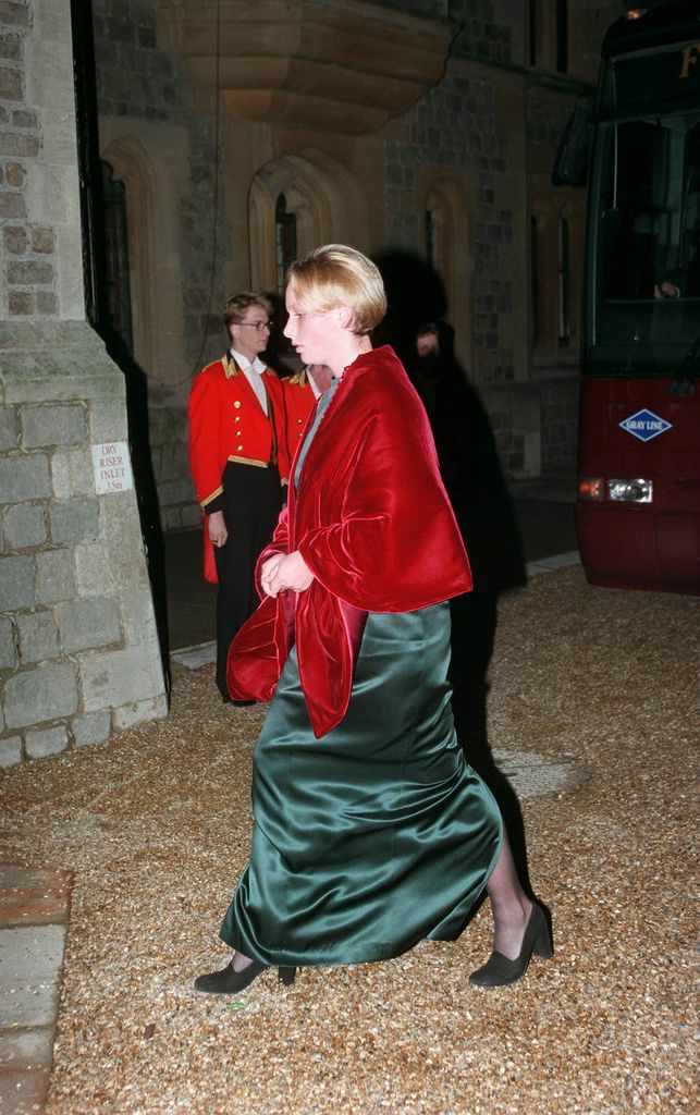 Zara Tindall in a green velvet dress and red velvet shawl