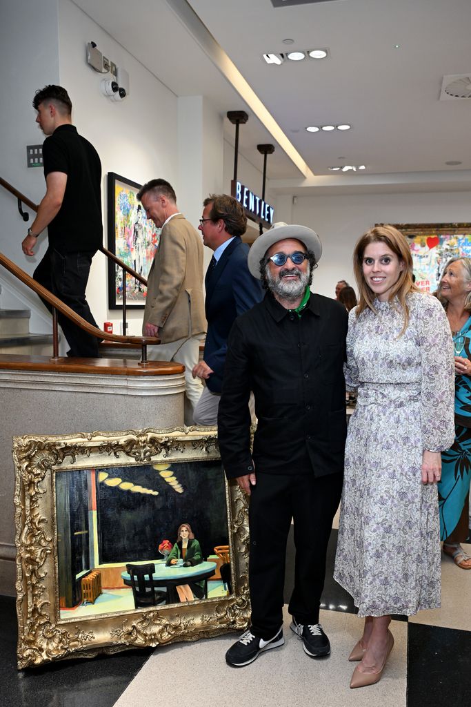 Princess Beatrice and Mr. Brainwash posed smiling