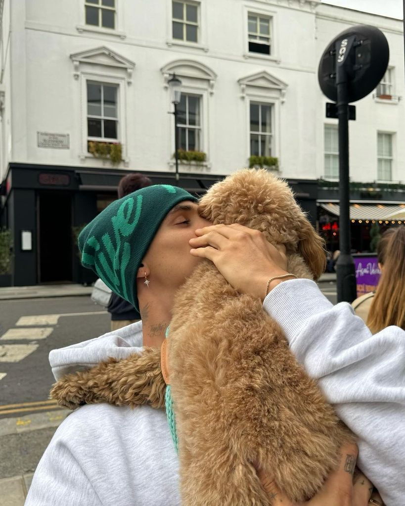 romeo beckham giving dog a kiss 