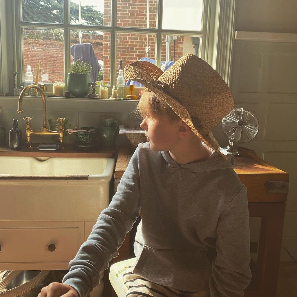 Buddy Oliver sits in the kitchen at their Essex home