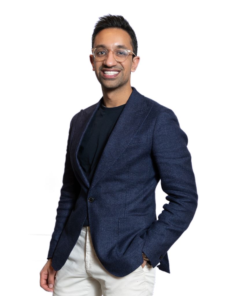 Man in black jacket and top smiling for the camera