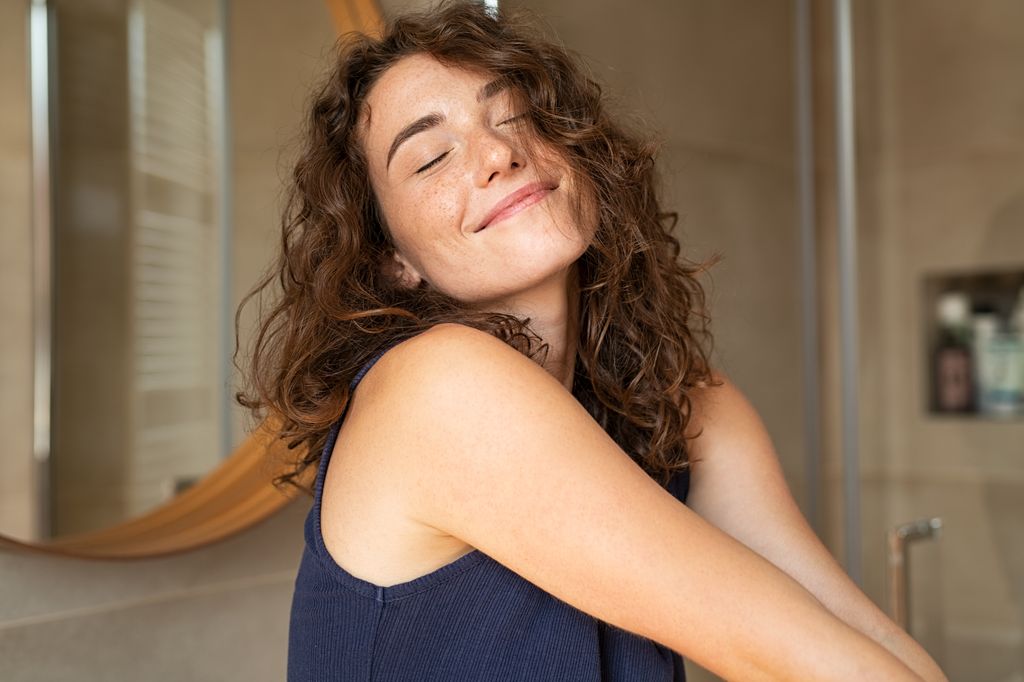 Woman smiling in blue top