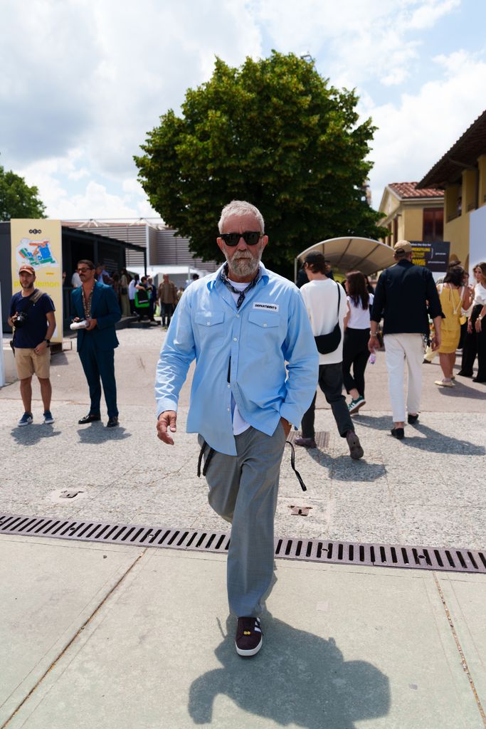 A guest wearing a blue shirt is seen during Pitti Immagine Uomo 106 on June 11, 2024 in Florence