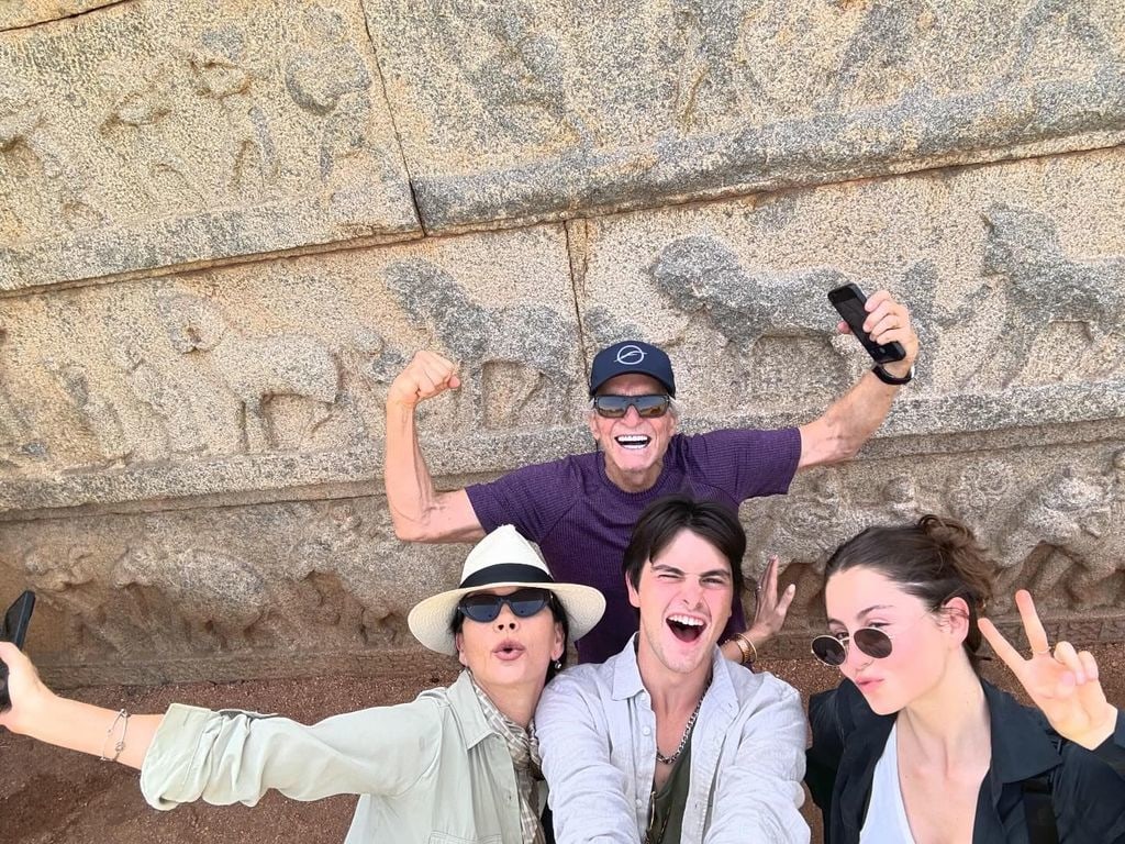 Michael Douglas flexed his muscles as he took a fun photo with his wife Catherine and their two children