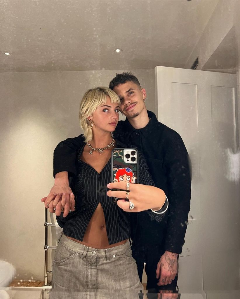 Mia Regan posing in the mirror with Romeo Beckham