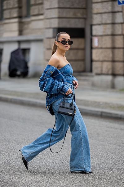 Woman wearing denim jacket with strapless corset