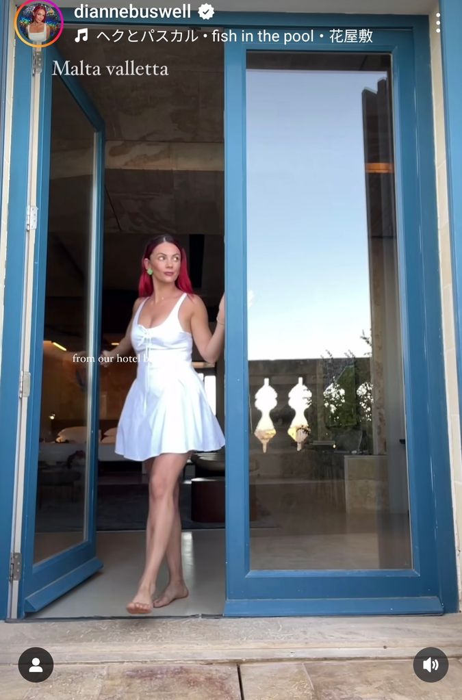 woman walking through door in white mini dress