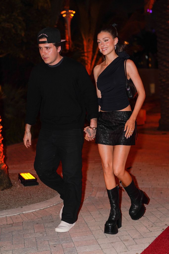 nicola peltz brooklyn beckham holding hands