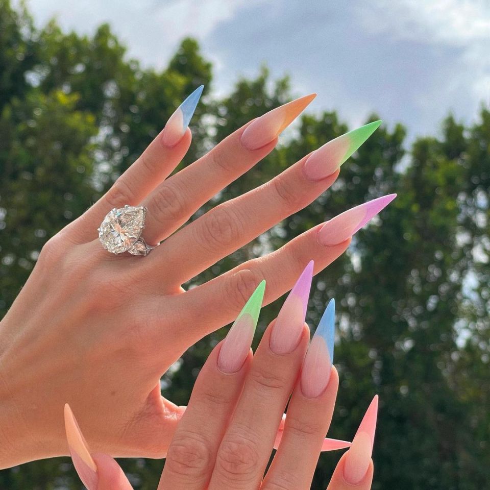 Khloe kardashian's hand showing diamond ring