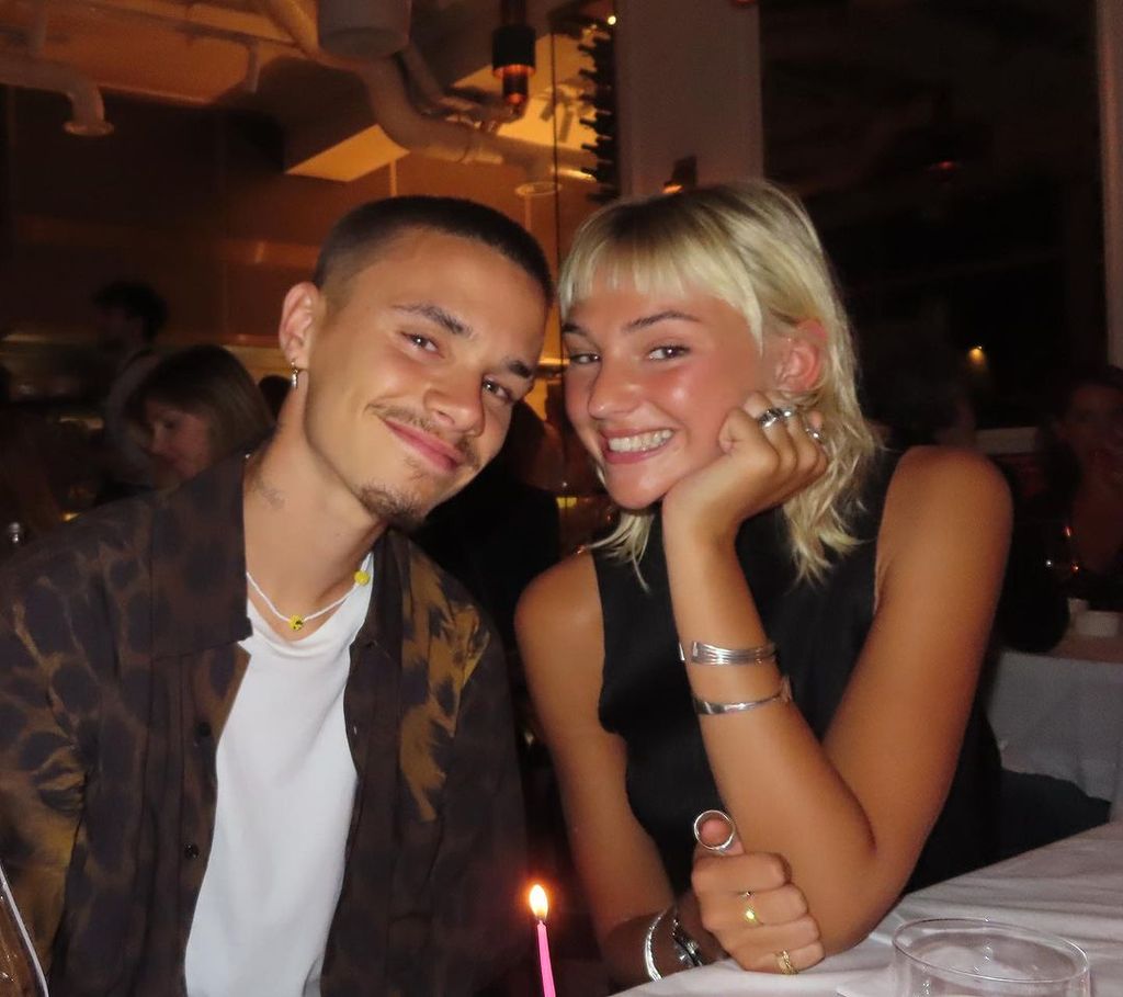 romeo beckham smiling with his girlfriend at dinner