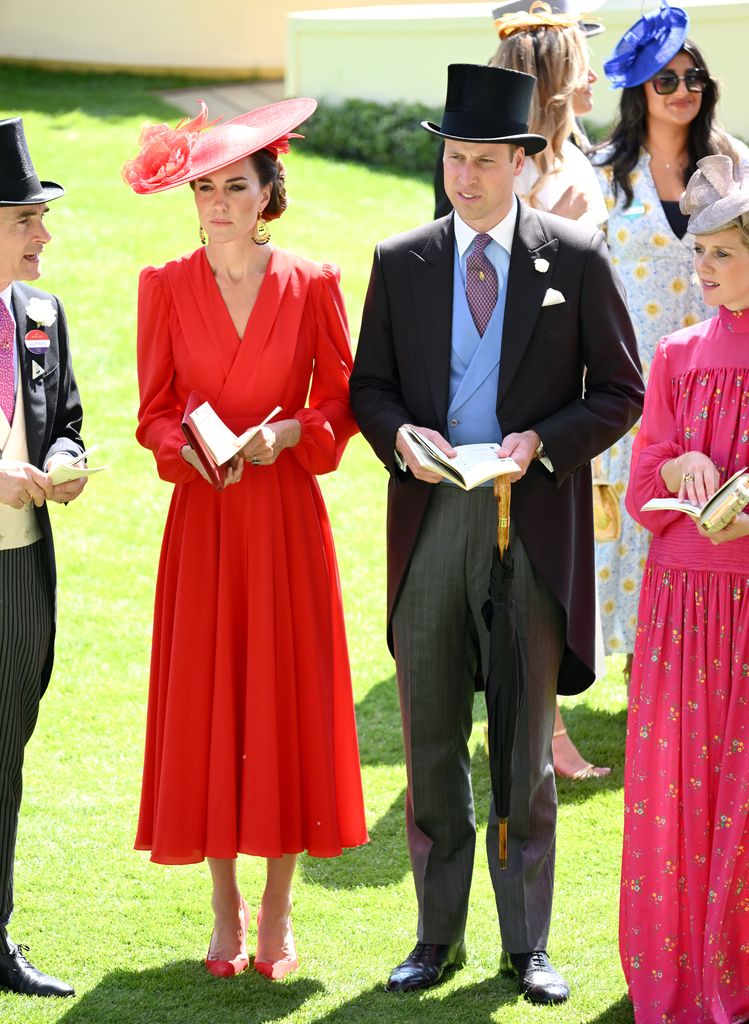 Princess Kate in red dress and Prince William in suit and top hat