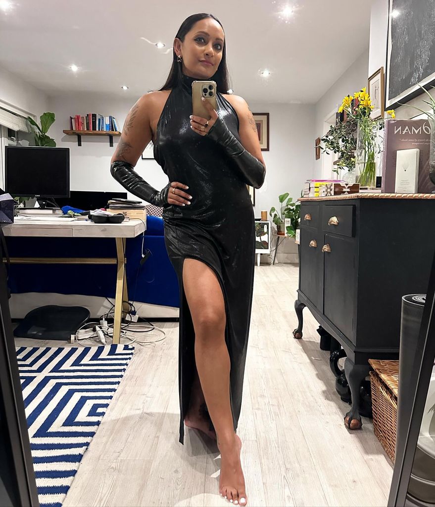 Woman in black thigh split dress