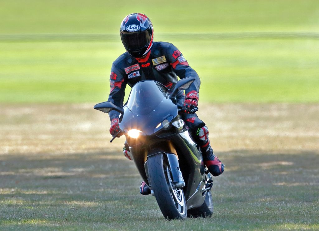 Prince William departs, riding his Ducati 1198S motorbike in 2009