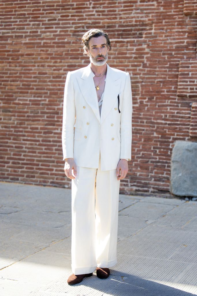  Richard Biedul wears white suit during Pitti Immagine Uomo 106 on June 12, 2024 in Florence, Italy