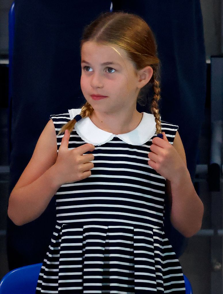 Princess Charlotte in stripes with her hair in braids