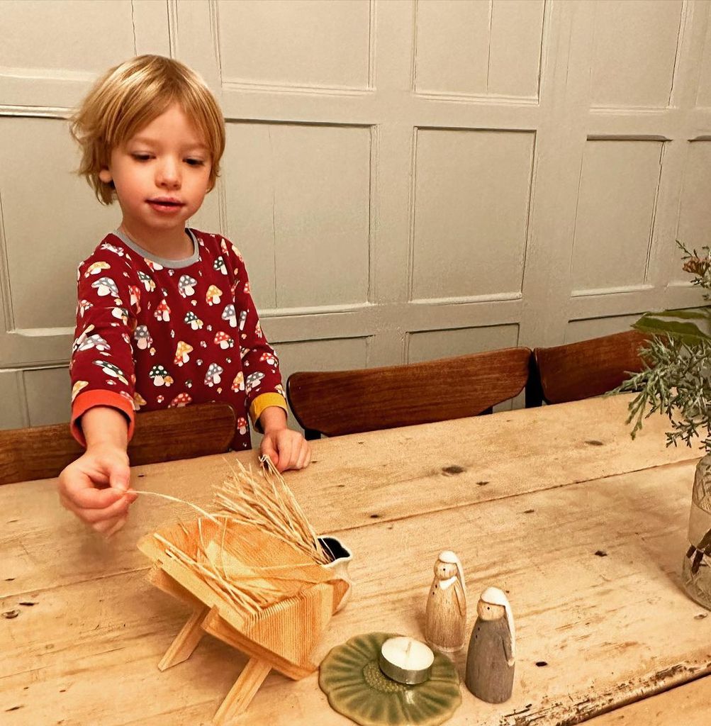 River Oliver standing at the family dining table 