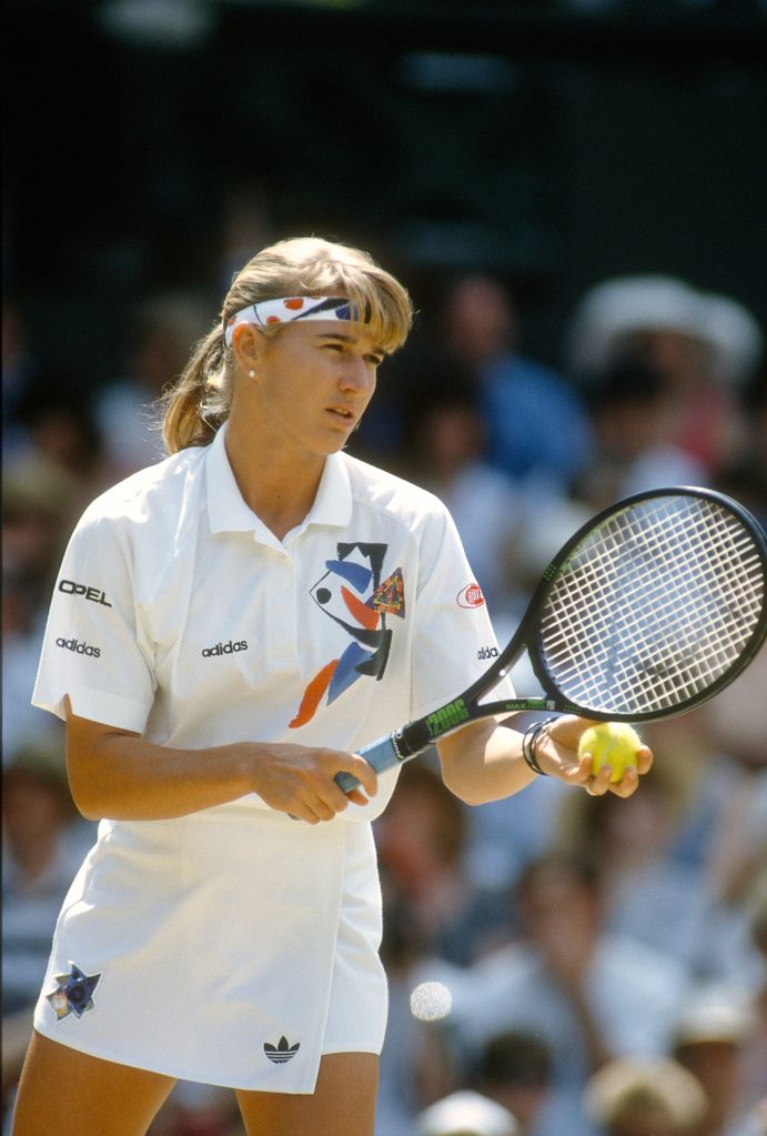 Steffi Graf of Germany serves during a women's singles match at the Wimbledon Lawn Tennis Championships circa 1991 at the All England Lawn Tennis and Croquet Club