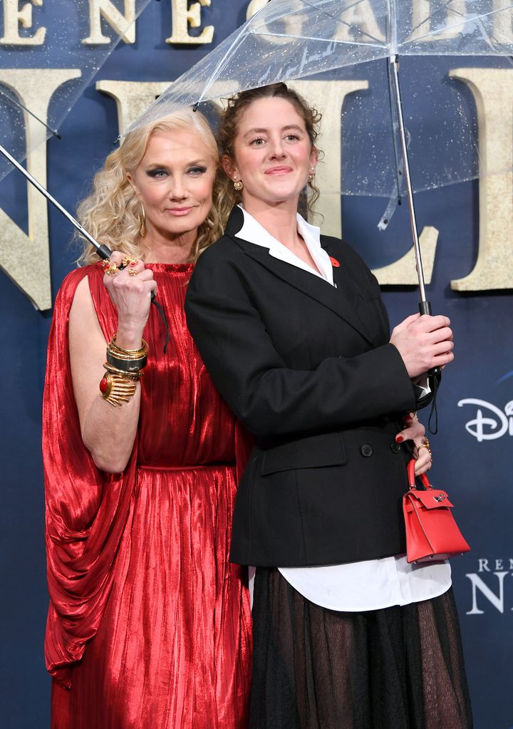 Joely Richardson and Louisa Harland underneath umbrellas