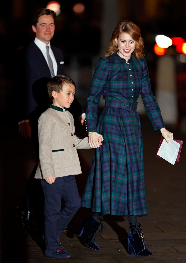 Edoardo Mapelli Mozzi, Christopher Woolf Mapelli Mozzi and Princess Beatrice attend The 'Together At Christmas' Carol Service at Westminster Abbey in 2023. Beatrice is wearing a tartan dress by Beulah London