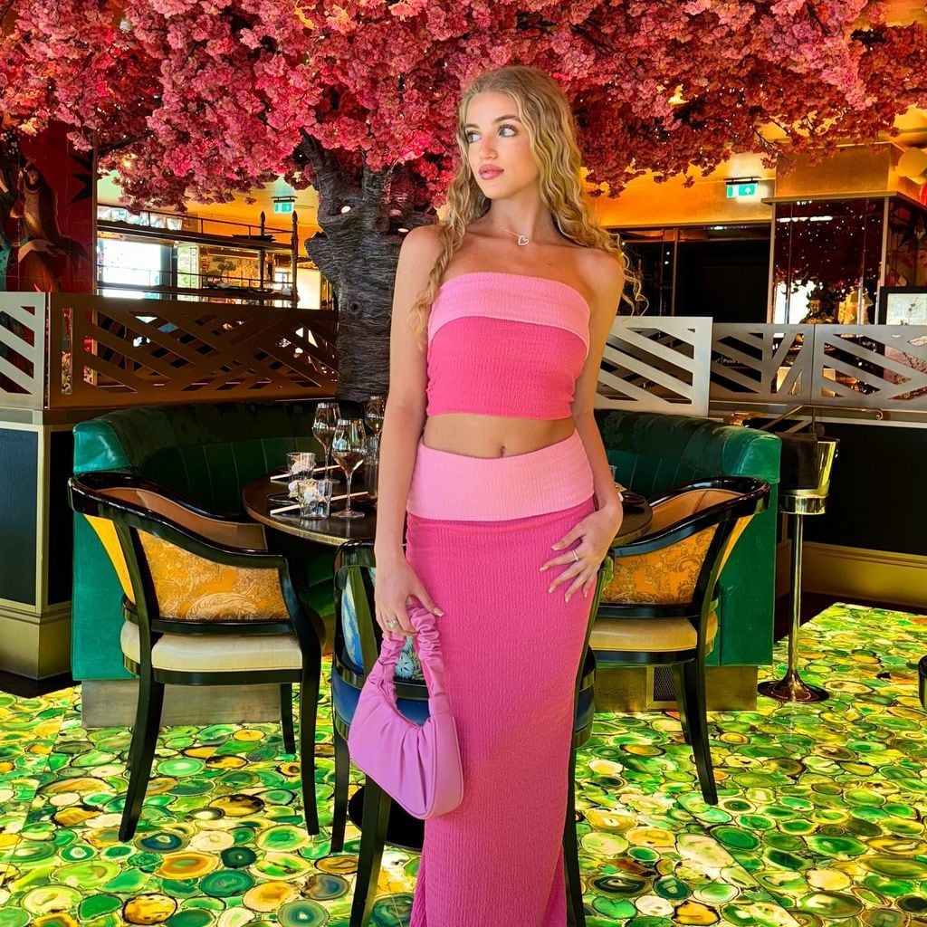 A photo of Princess Andre in a pink co-ord