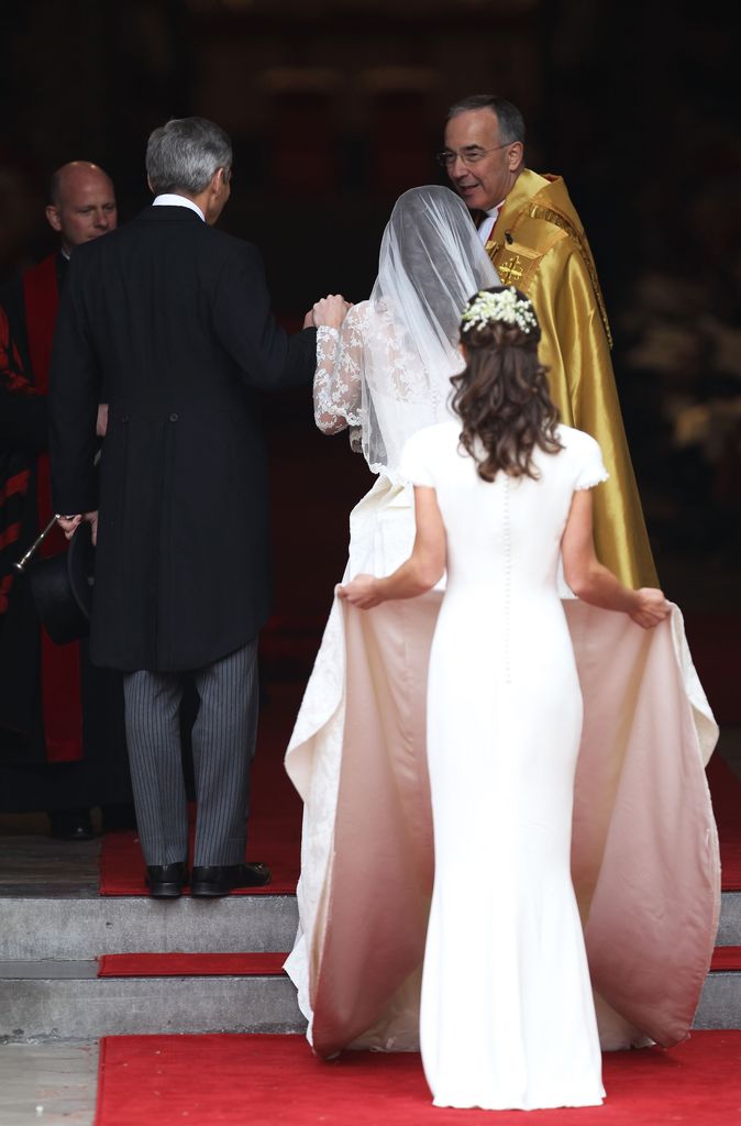 Kate's sister Pippa holding up her train