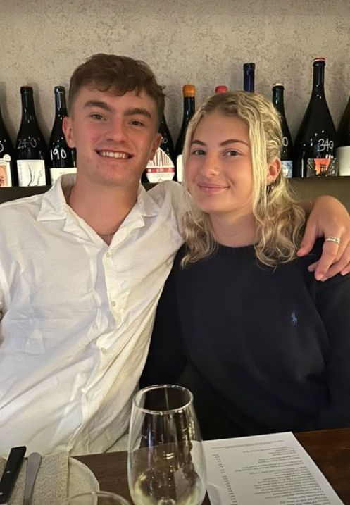 Poppy Oliver sat with her boyfriend