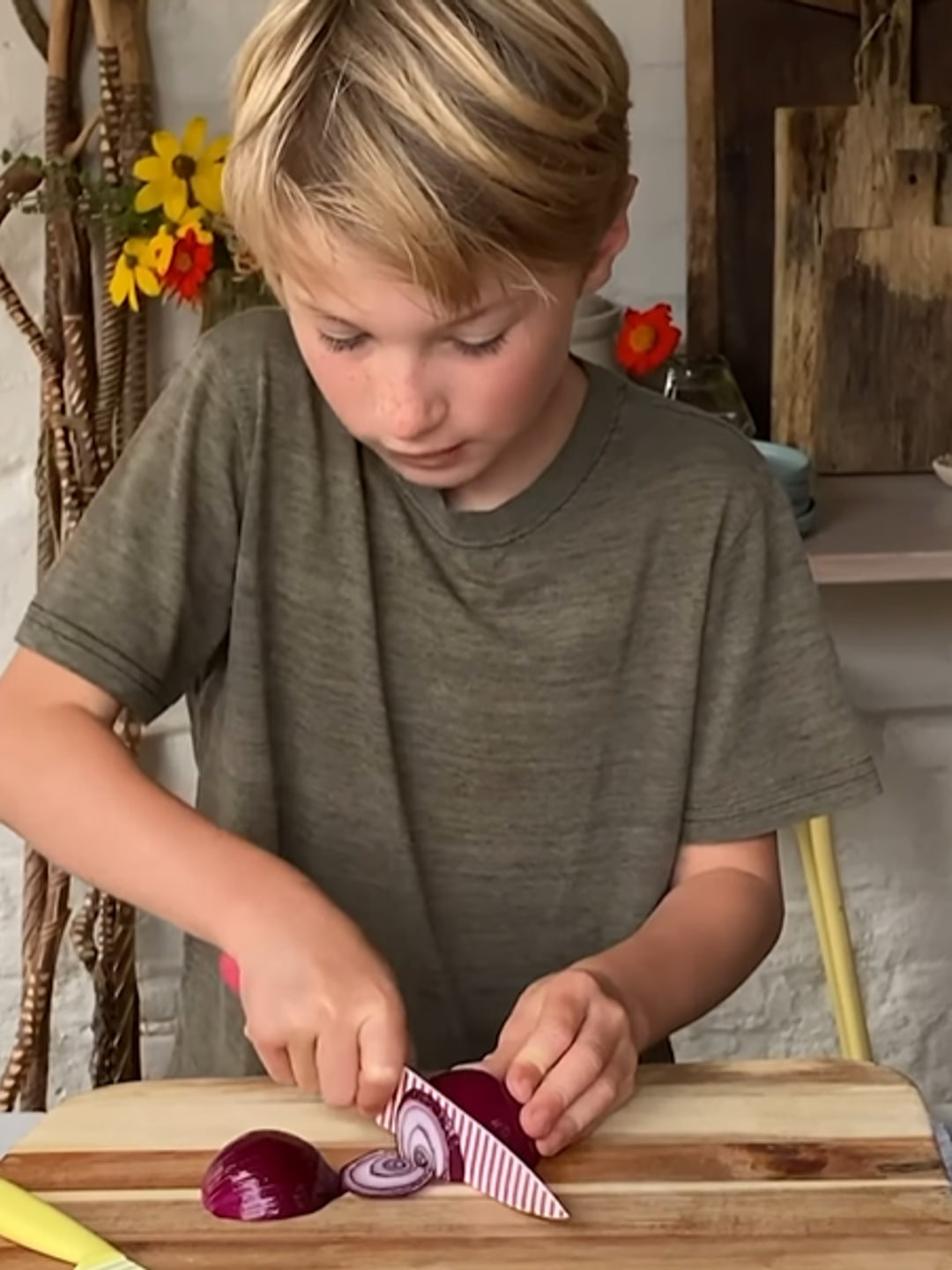 Buddy Oliver cooks in their outdoor kitchen