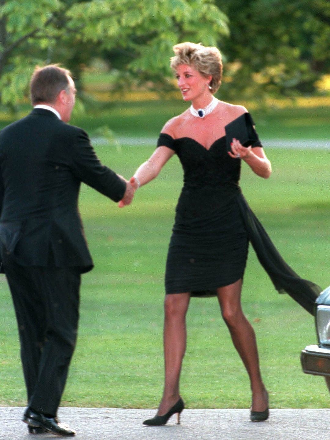 Diana, Princess of Wales, attends the Vanity Fair party at the Serpentine Gallery wearing the famous black "revenge dress" 