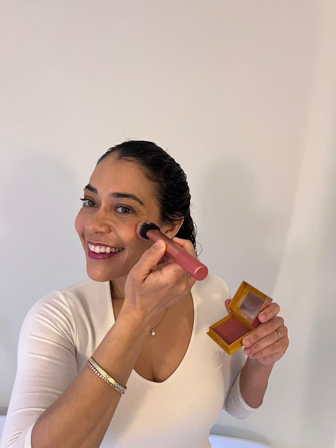 Dr Alexandra Germain applying evening makeup