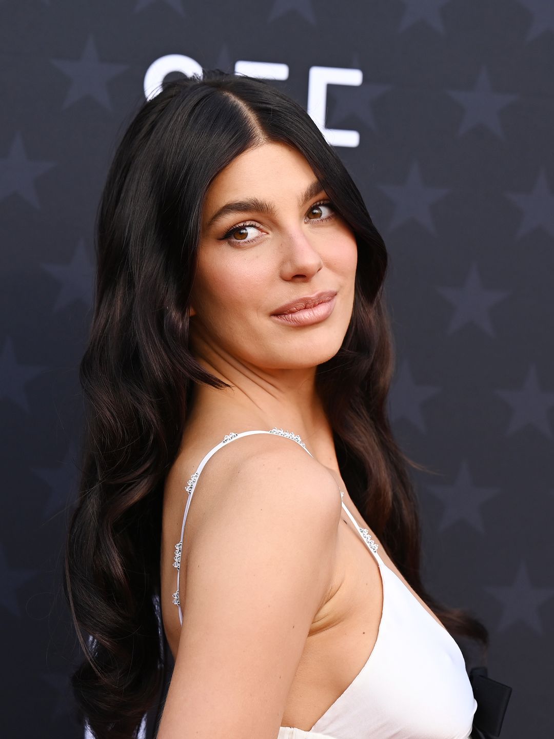 Camila Morrone smiling on the red carpet at the Critics' Choice Awards 